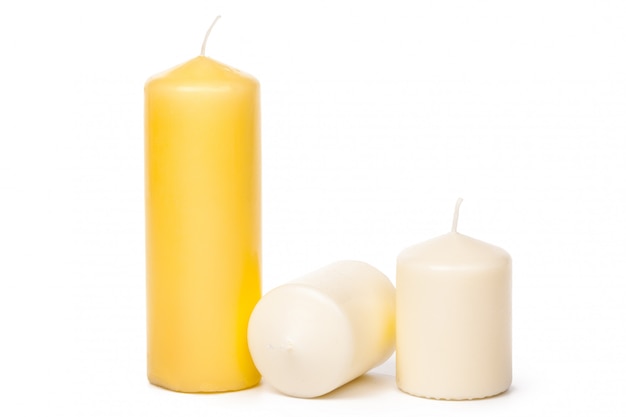 different sized candles on a white 