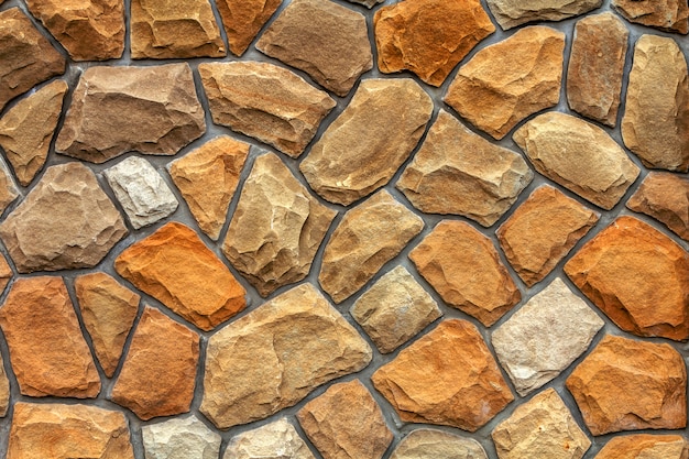 さまざまなサイズの砂岩。石の壁のパターンの背景
