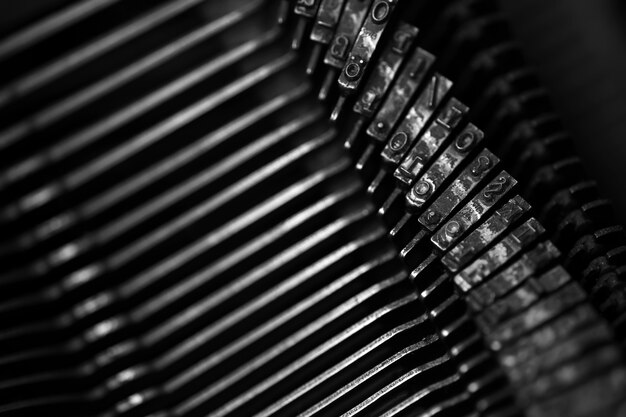 Different small metal elements of an old typewriter macro