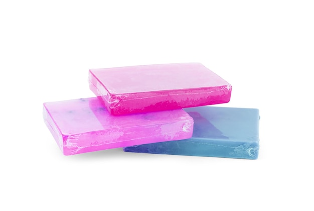 Different soaps in different soap dishes. A lot of solid soap for hygiene and cleanliness. Colorful soap and remnants are scattered