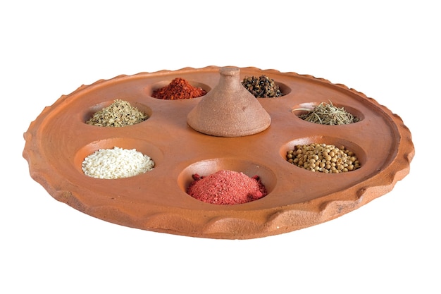 Different spices and herbs in clay pit tray for cooking Thai food on background