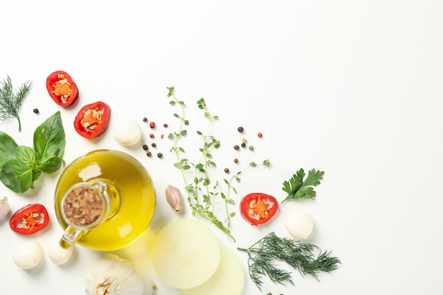 Different spices and herbs on white background, top view
