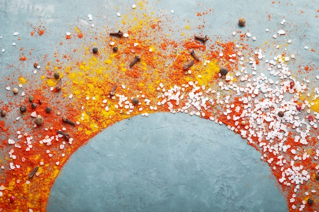 Different spices scattered on a table