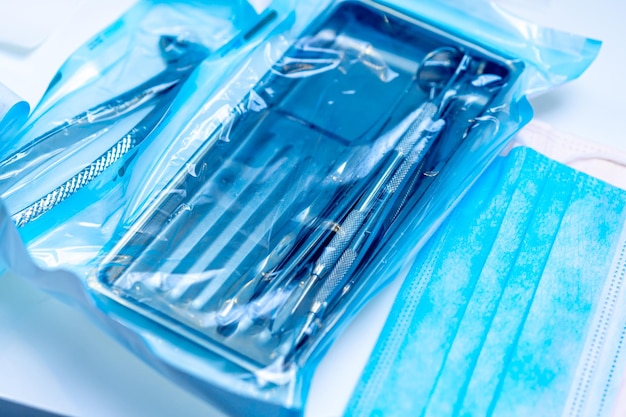 Different sterile dental instruments Individual packaging Dental concept