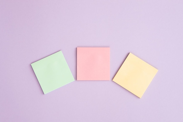 Different sticky notes on pink background