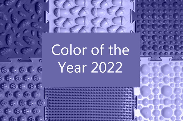 Different surfaces of orthopedic mats with the inscription color of the year 2022