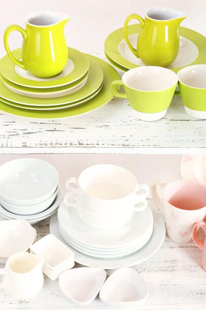 Different tableware on shelf close up