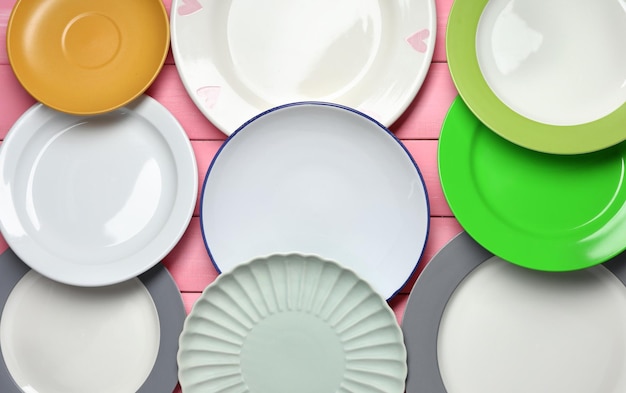 Different tableware on wooden background