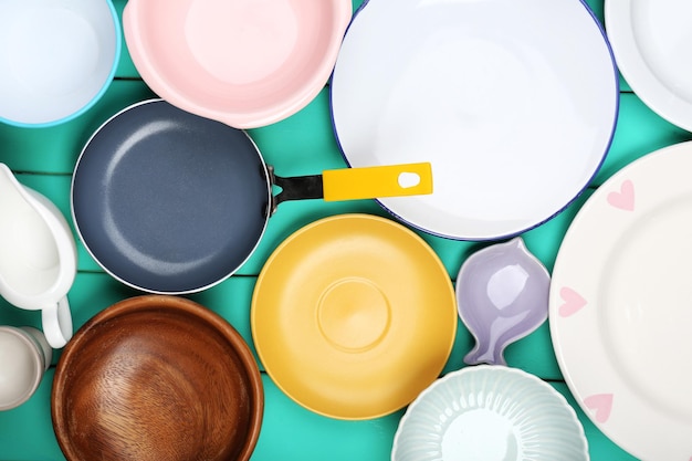 Different tableware on wooden background