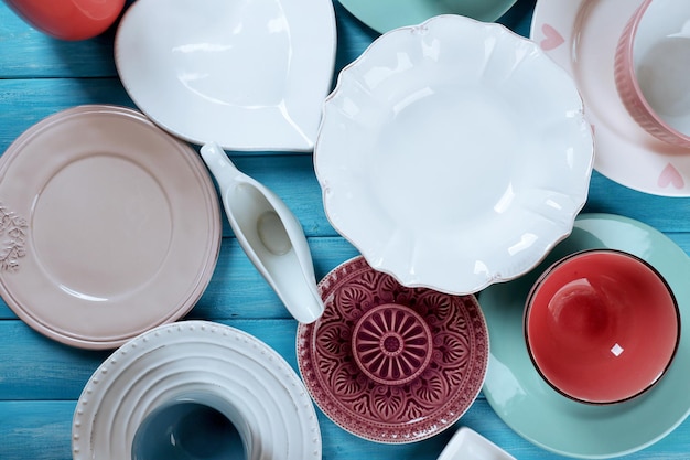 Different tableware on wooden table close up