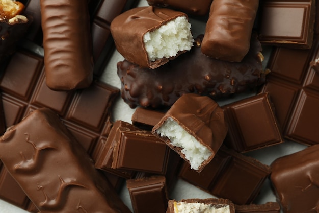 Different tasty chocolate candy bars, close up