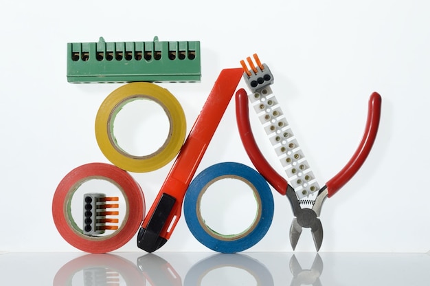 Different tools for electronics repair laid out on a white background