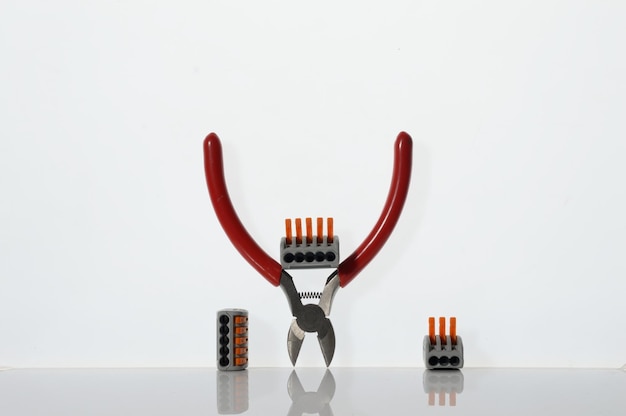 Different tools for electronics repair laid out on a white background