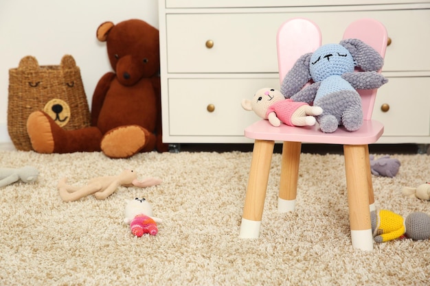 different toys and chair in kid39s room