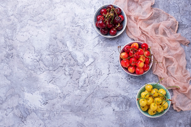 Different type of colorful cherries. Selective focus