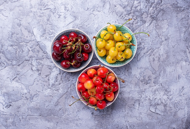 Different type of colorful cherries. Selective focus