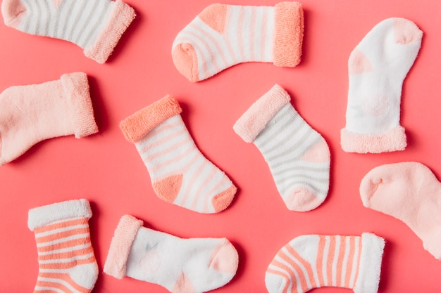 Photo different type of socks on bright backdrop