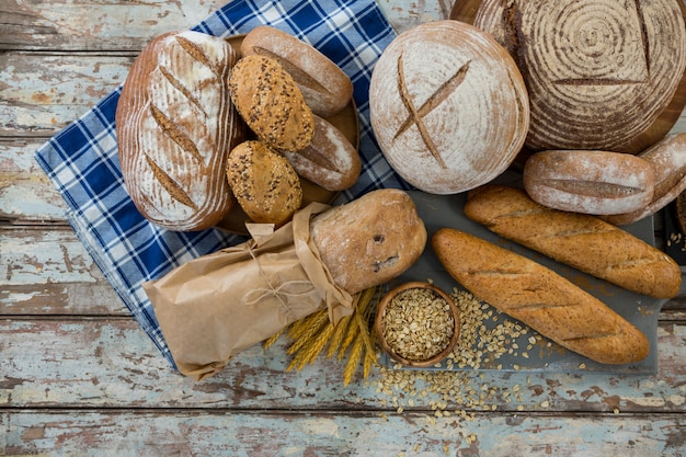 Different types of bread with wheat grains and oats