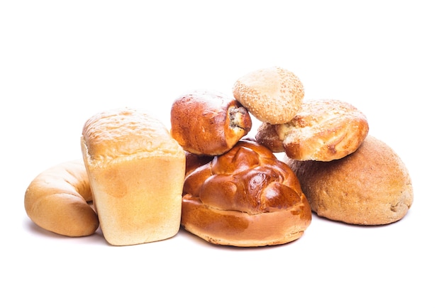 Different types of breads and buns isolated on white