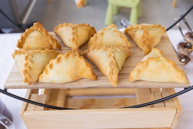 Different types of canapes on buffet table.