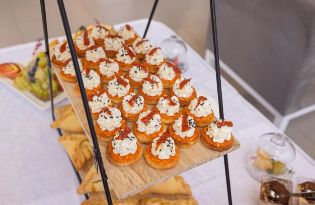 Different types of canapes on buffet table