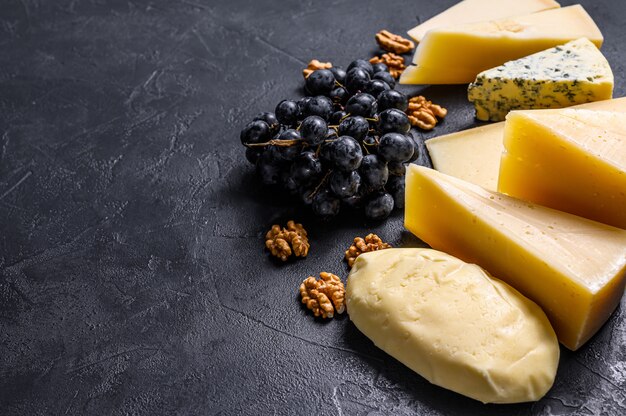 Different types of delicious cheese. Top view. Copyspace background