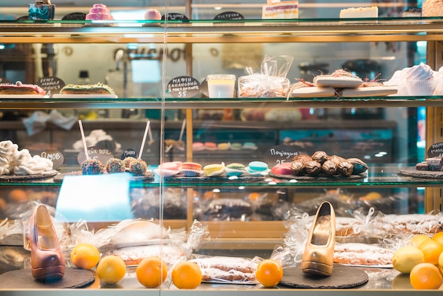 Different types of desserts in the glass cabinet