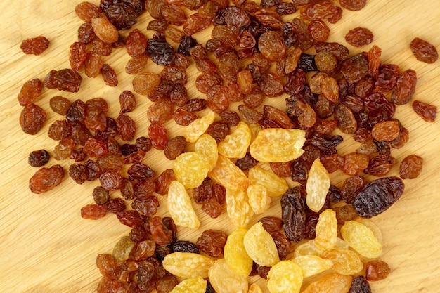 Different types of dried raisins closeup Snacks from dried fruits Selective focus