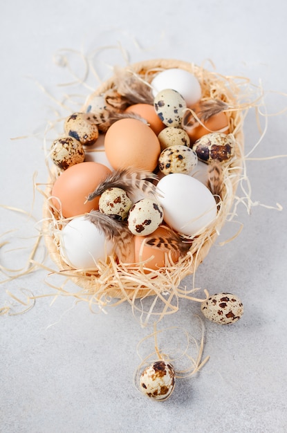 Different types of eggs in a basket.