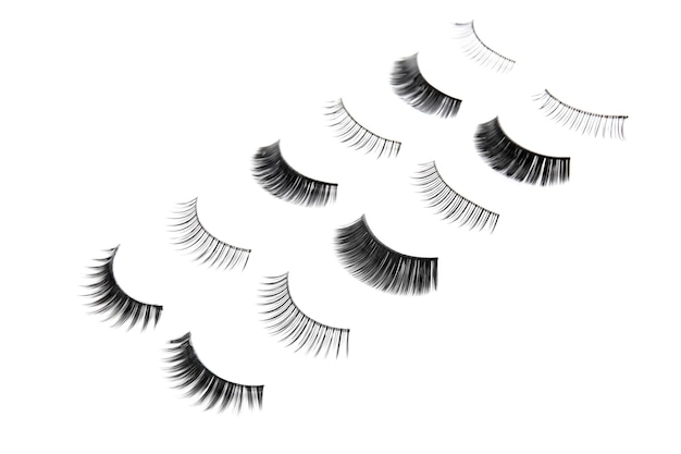 Different types of false eyelashes on white background