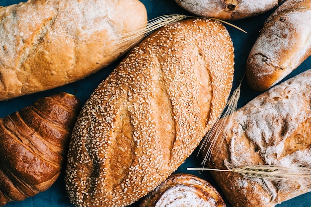 Different types of fresh bread and bakery on the table.