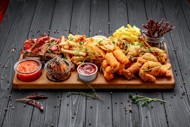 Different types of fried snacks, croutons, meat