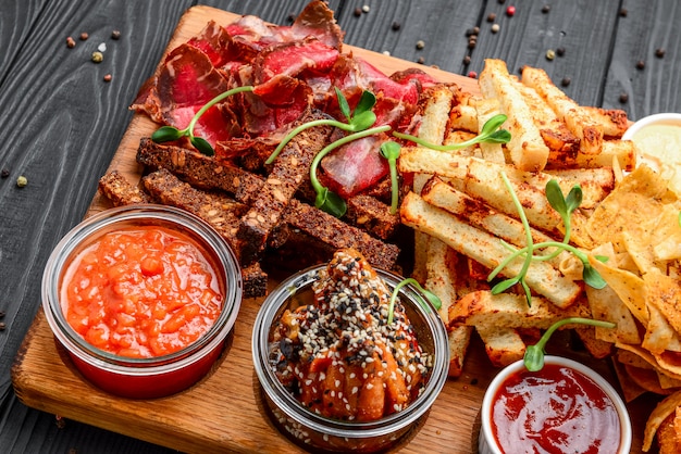 Different types of fried snacks, croutons, meat