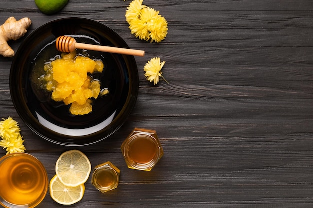 Different types of honey on a dark wooden background top view copy space
