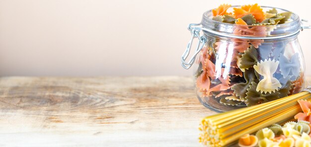 Different types of italian pasta in glass jars