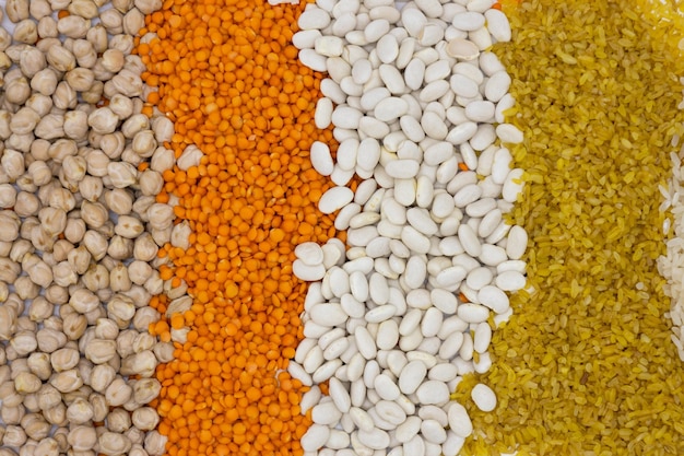 Different types of legumes on a white background