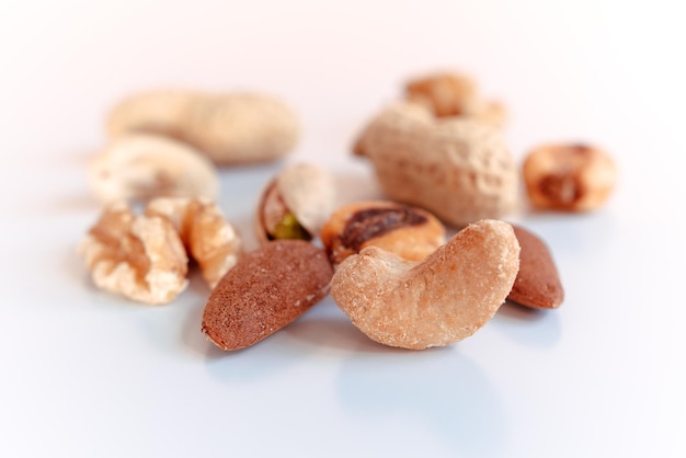 Different types of nuts on a white background