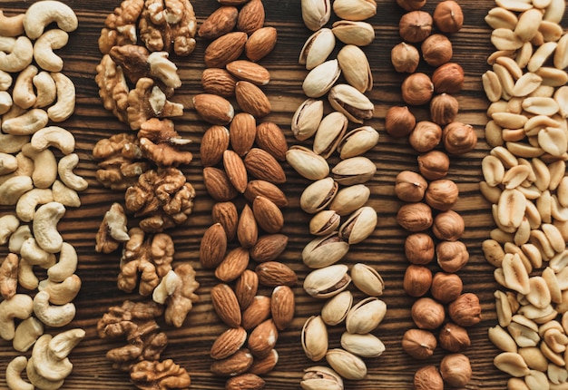 Different types of nuts on a wooden cutting board