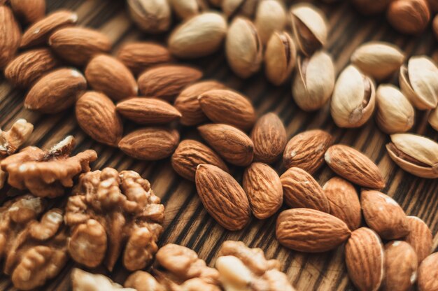 Different types of nuts on a wooden cutting board