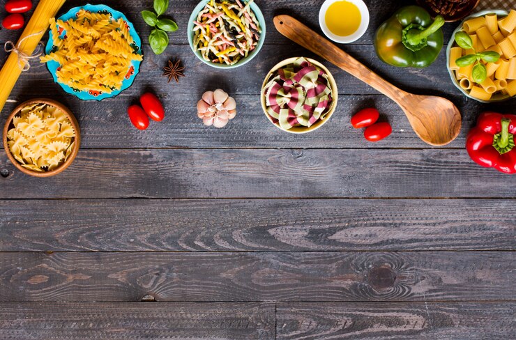 Photo different types of pasta with various types of vegetables, health or vegetarian concept,  top view
