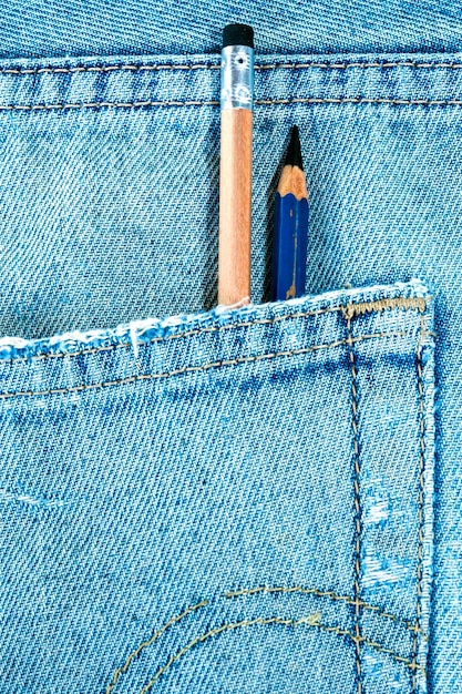 Photo different types of pencils in the pocket of denim blue jean