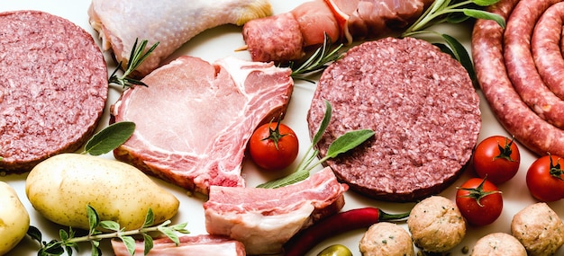 Different types of raw meat and vegetables