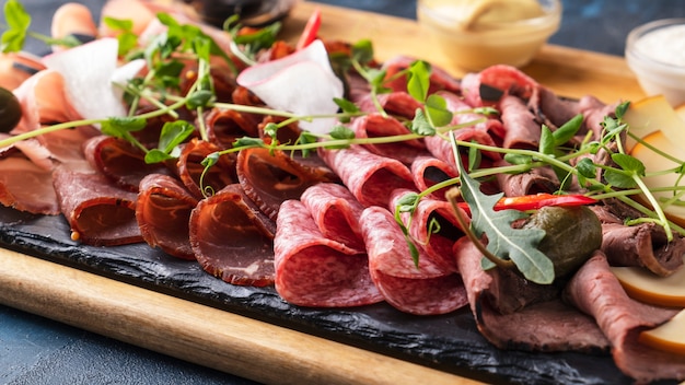 Different types of sausages and smoked meats. Closeup