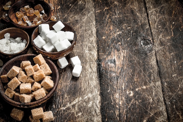 Different types of sugar in bowls.