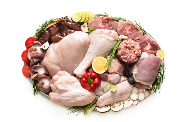 Different types of turkey meat and chicken, steaks, carcass poultry for cooking, top view on a wooden board, isolated. Flat lay, cooking concept