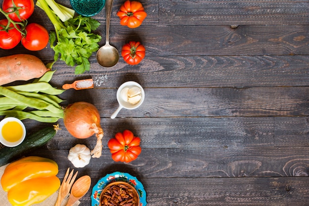 Different types of vegetables, on a old wooden table, space for text.