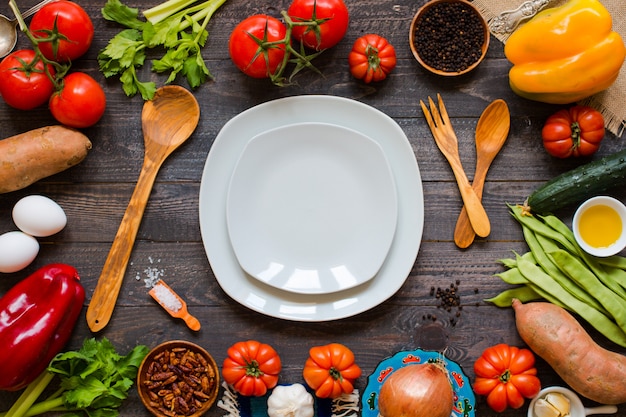 Different types of vegetables, on a old wooden table, space for text.