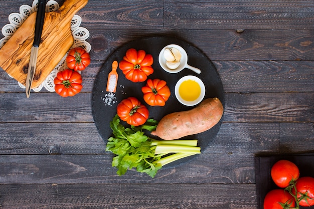 Different types of vegetables, on old wooden table