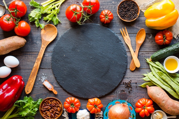 Different types of vegetables, on old wooden table