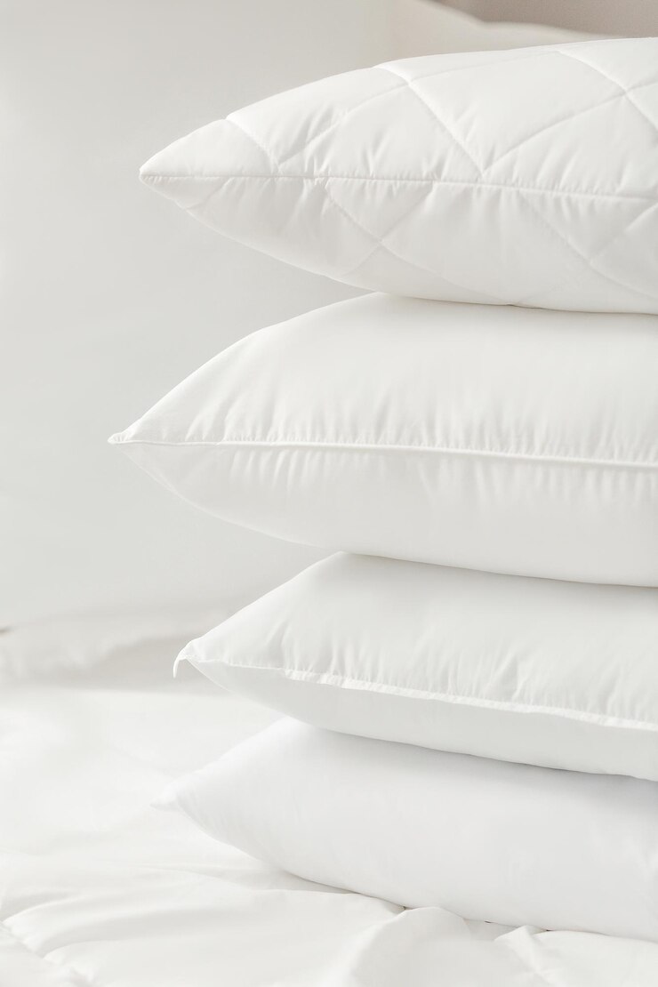 Photo different types of white bed pillows on a white bed pillow menu cushions home textile